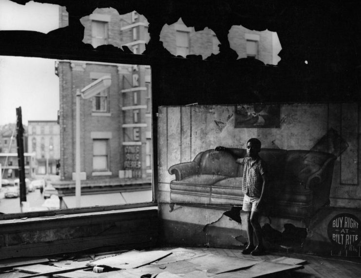 Arthur Tress, Boy in Burnt-out Furniture Store (1969)
